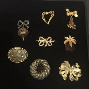 Set of 8 Gold Brooches